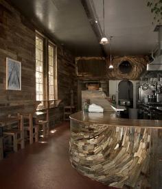The rustic wooden interior of San Francisco’s Outerlands is as much of a draw to the celebrated Outer Sunset eatery as its famous loaves of bread, which are baked in-house, daily.  Photo by Barret Gentz.