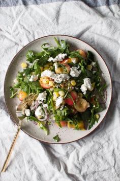 sweet corn, peach, and cherry salad with creamy goat cheese and a lime dressing