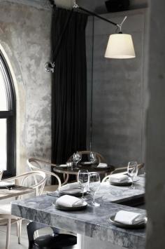 love the rough concrete walls with the smooth granite counters and minimal mid-grey floor = awesome texture + color.