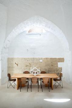 Ludovica Serafini and Roberto Palomba, who work as Ludovica+Roberto Palomba, commissioned a dining table of their own design from Exteta and paired it with Abanica chairs by Oscar Tusquets for Driade. The ceramic centerpiece is by Emilia Palomba, Roberto’s aunt.  Photo by: Francesco Bolis