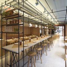 A counter acts as a spine running from the door into the main dining area – at the front of the restaurant the greater height means it’s used as as a take-away and waiting area, while the surface is 20cm closer to the ground in the back and more suited to sit-down dining...