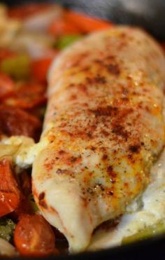 Fresh organic chicken breasts stuffed with a soft garlic & herb cheese nestled in a bed of large chunky zucchini, peppers, onions, plum tomatoes and celery.  Balsamic oil and EVOO is drizzled on top and baked until done.