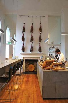 
                    
                        In a reference to street food and informal eating, the galvanized steel grilles evoke street furniture and are inspired by the steel drains seen on the street. On a practical note, they conceal atmospheric lighting.
                    
                