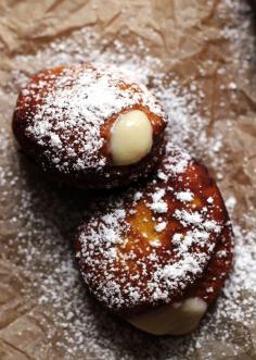 maple pumpkin doughnuts with a maple cream filling