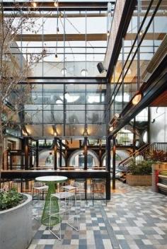 
                    
                        The downstairs new rear section of the pub spills in tot he beer garden.
                    
                