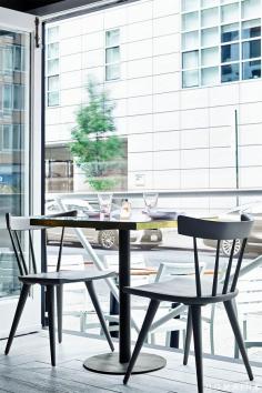 
                    
                        The Upsider NYC // Table vignette with Paul McCobb chairs in charcoal gray.
                    
                