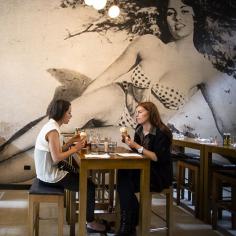 
                    
                        The décor is understated in terms of colour, which lets the vibrant food shine, but there’s no chance of missing the main attraction – a floor-to-ceiling mono mural of the titular Mamasita reclining seductively in the sand...
                    
                