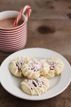 
                    
                        PEPPERMINT BARK THUMBPRINTS
                    
                