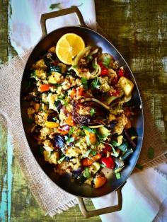 Roasted Veggie Quinoa Salad: sub vegetable broth Quinoa 1 c. RINSED quinoa 2 c. chicken stock 1 tsp extra virgin olive oil 4 cloves garlic, chopped 1/2 tsp sea salt Roasted Vegetables 2 bell peppers, cubed 1 zucchini, cubed 1 squash, cubed 1 red onion, cubed 1 fennel bulb, cubed 4 garlic cloves, whole 1 Tbsp Herbs de Provence 2 Tbsp extra virgin olive oil 1/2 tsp smoked salt Dressing 1/2 lemon, juiced and zested 2 Tbsp extra virgin olive oil fresh herbs