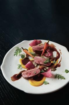 
                    
                        Tokyo chef Shinobu Namae has already made his mark at his haute modern-French L’Effervescence. Now he’s brought his ingredient-centric menu to a wider audience at La Bonne Table, a minimalist bistro in the Nihonbashi district. A seemingly simple salad of vegetables—plucked at the very moment of ripeness at an organic farm nearby—is just as showstopping as his buttery, flaky boudin-noir pie.
                    
                