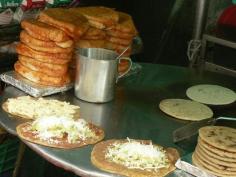 
                    
                        Here's what to order in Mexico City: Tlacoyos (corn patties filled with fava or bayo beans and topped with queso blanco); quesadillas with squash flowers; rajas (charred poblano peppers and onions); quelites (wild greens); tacos al pastor with spit-roasted pork.
                    
                