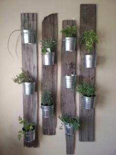 
                    
                        Creative Indoor Vertical Wall Gardens • Lots of Great Ideas and Tutorials! Including, this idea of small tin buckets attached to repurposed wood. Love this look!
                    
                