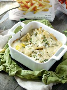 
                    
                        BREAKFAST POUTINE WITH KASSERI CHEESE AND FRESH HERBS
                    
                