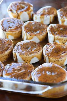 
                    
                        Hot Ham & Cheese Roll-Ups with a Brown Sugar Poppy Seed Glaze. Perfect for taking to friends, new moms, and family because you can assemble it the night before and bake it the next day.
                    
                