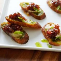 
                    
                        Brie and Basil Crostini with grape relish.
                    
                