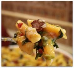 Baked Penne with Spinach, Roasted Peppers and Bacon     Yield: 8 to 10 servings     Prep Time: 25 min     Cook Time: 35 min      Ingredients:  SAUCE:   16 ounce container of Pacific Natural Foods Roasted Red Pepper & Tomato Soup   2 cups 2% milk   4 Tablespoons butter   1/4 cup all-purpose flour   freshly ground pepper, to taste     PASTA:   1 pound penne pasta (or ziti), cooked until tender, but still firm to the bite   1 package frozen chopped spinach, thawed & squeezed dry   3/4 cup chopped jarred roasted red peppers   1 1/2 cups cubed Provolone cheese   8 slices of cooked bacon, crumbled   1 1/2 cups shredded Parmesan cheese, divided   Freshly ground black pepper   kosher salt     Directions:       1. Preheat oven to 350 degrees F. Spray 9x13-inch pan (or other 2 1/2-quart baking dish) with nonstick spray.     2. Prepare sauce: Heat soup and milk in a medium saucepan until small bubbles begin to form around the edges (just until hot). In a larger saucepan, melt butter over medium-low heat. Add flour and stir well. Continue to cook, stirring, until thick and smooth, about 2 minutes. Slowly begin adding hot soup/milk mixture to the large saucepan, whisking constantly while adding. Sauce will start out lumpy and become smooth as the liquid is incorporated.     3. Assemble the dish: In a large bowl, toss cooked pasta with the sauce. Break apart the spinach with your fingers and add it to the bowl. Also add red peppers, provolone cheese and 3/4 cup of Parmesan. Stir until ingredients are evenly distributed. Pour the mixture into the prepared dish. Sprinkle with bacon crumbles and top with remaining Parmesan cheese. Finish with a good dose of freshly ground black pepper and a sprinkle of kosher salt.     4. Cover with aluminum foil. Bake 25 minutes. Uncover and bake until sauce is bubbling around the edges and the center is hot (about 10 minutes more). Remove from the oven and let cool for about 10 minutes before serving.