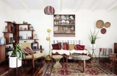 
                    
                        The Brisbane home of Rose Jensen-Holm and Dan James.  Above – loungeroom. Midcentury Don Rex teak lounge chair and couch, Rose’s favourite $45 Vinnie’s op shop oil painting, and 1960’s yellow metal mod floor lamp. Photo – Eve Wilson. Production – Lucy Feagins / The Design Files.
                    
                