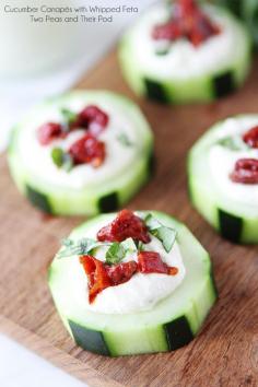 Cucumber Canapés with Whipped Feta, Sun-Dried Tomatoes and Basil on twopeasandtheirpo... An easy appetizer for the holidays! #appetizer