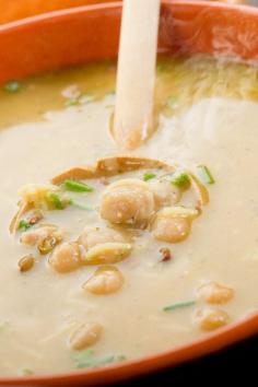 Creamy Chickpea Soup #Recipe Ingredients Serves 6 3 tbsp olive oil 5 garlic cloves, finely chopped 1 tbsp fresh rosemary, minced ⁄ tsp crushed red pepper flakes 3 can (15 - 19 ounces each) garbanzo beans, rinsed & drained 4 cup chicken broth, (or vegetable) 2 tbsp fresh lemon juice 1 sea salt Directions 1. In a large saucepan, heat the oil over medium heat and add garlic, rosemary and red pepper flakes. 2. Cook, stirring constantly, until the garlic starts to brown, about 1 minute. Add chickpeas and cook 2 minutes, stirring constantly. Add chicken broth and bring to a boil. 4. Reduce heat and simmer 30 minutes; let cool slightly. 5. Transfer soup to a blender; cover loosely, and puree until just smooth. 6. Return to the saucepan and stir in lemon juice and sea salt to taste. 7. Serve, garnished with a fresh rosemary sprig, or an additional drizzling of olive oil.