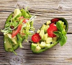 Recipe | 7 GREEN Salads with Sweet Berries ~ Halve one avocado. Left: Top with baby endive and tomatoes. Right: Dice the avocado flesh; add sliced strawberries and fresh basil. #salads #avocado #freshsalad