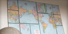 DIY world map wall art. There's something to be said for a powerful grouping of canvases. Especially when they're covered with sections of a thrift store map. The creator of this project took special care to give the borders of each canvas an aged effect, which plays up the vintage quality of the artwork. 25 DIY Wall Art Ideas