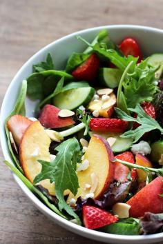 
                    
                        Try this fruity Strawberry Peach Salad for a fresh, fast, and healthy meal any time of day! Fresh greens topped with juicy peaches, ripe strawberries, cucumber, goat cheese, sliced almonds, and a yummy honey balsamic dressing. | LoveGrowsWild.com
                    
                