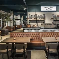 
                    
                        The mural portrait of the proprietress, powerfully positioned up high among the old tanks and pipework, suggests she's not the middle-aged matron one might expect from the name. Along with some original factory fittings and equipment, the venue has retained an industrial materiality...
                    
                