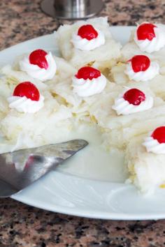 Hawaiian Wedding Cake 1 package (18.25 ounce) yellow cake mix   2 can (20 ounces each) crushed pineapple, drained   1 package (3.4 ounce) instant vanilla pudding mix   1 package (8 ounce) cream cheese   1 container (8 ounce) frozen whipped topping, thawed   1⁄2 cup flaked coconut   1⁄2 cup walnuts, chopped   1⁄2 jar (10 ounce) maraschino cherry