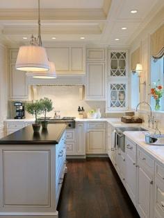 ♥ everything about this kitchen- white cabinets with dark wood floors, farmhouse sink, both countertop finishes, pendant lights over island. Perfect! What is the design on the glass door?