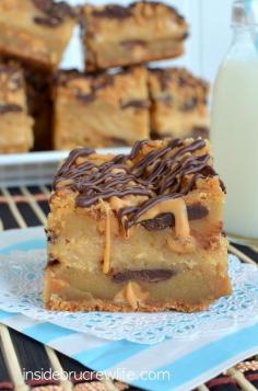 Peanut Butter Cheesecake Cookie Bars peanut butter cheesecake in the middle of peanut butter and chocolate chunk cookie bars