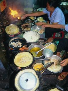 Photographic Print decor by Tim Hall. Cook in Restaurant; Ho Chi Minh City (Formerly Saigon); Vietnam; Indochina; Southeast Asia; and other photography; color photography; food & beverage (color photography); food (color photography) wall art; posters; and prints for home wall coverings are available.