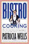 Bistro is warm. Bistro is family. Bistro is simple, hearty, generous cuisine-robust soups and country omelets, wine-scented stews and bubbling gratins, and desserts from a grandmother's kitchen. Researched and written by Patricia Wells, author of The Food Lover's Guide to Paris and The Food Lover's Guide to France, together with over 220,000 copies in print, here is a celebration of the no-nonsense, inexpensive, soul-satisfying cuisine of the neighborhood restaurants of France. BISTRO COOKING contains over 200 scrumptious bistro recipes made lighter and quicker for the way we cook today. Warm Poached Sausage with Potato Salad. Benoit's Mussel Soup. Guy Savoy's Fall Leg of Lamb. Beef Stew with Wild Mushrooms and Orange, Chicken Basquaise, Pasta with Lemon, Ham, and Black Olives, L'Ami Louis' Potato Cake, Provencal Roast Tomatoes, Pears in Red Wine, and Golden Cream and Apple Tart. Throughout, lively notes and sidebars capture the world of bistro owners in the kitchen, les grands chefs, and more. Selection of the Book-of-the-Month Club. Winner of the 1989 IACP Seagram Food and Beverage Award. Over 166,000 copies in print.