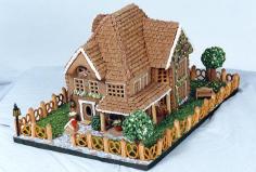 This cozy house, built by Joan Grunzweig of Los Alamitos, California, features details like a bench, a mailbox, a street lamp, and an adorab...